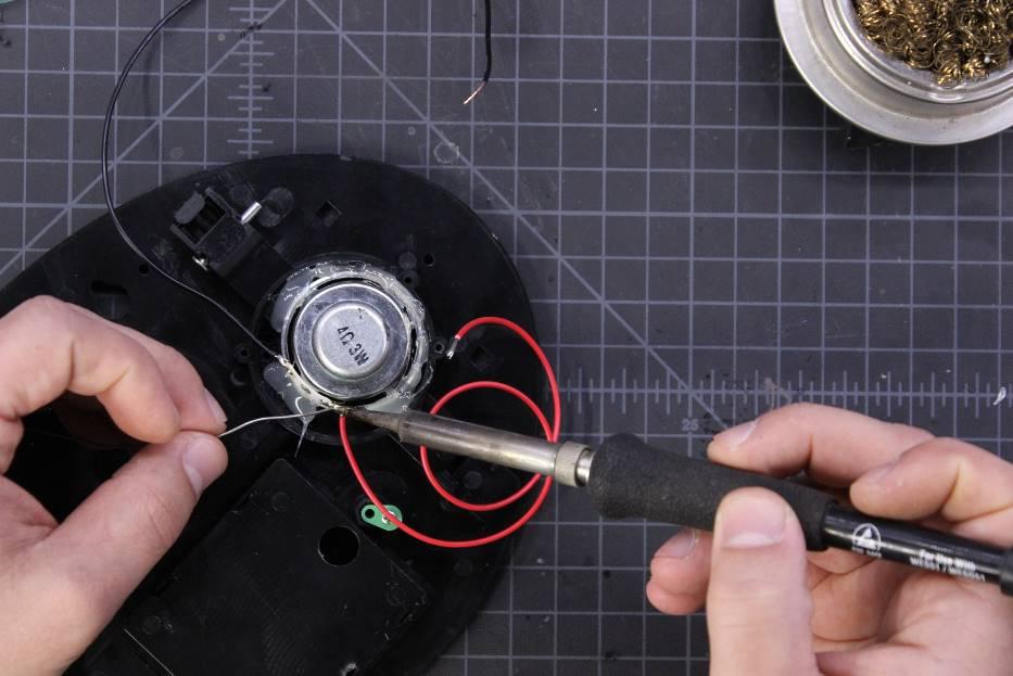 Measure, cut, strip, and solder the wires to each of the speakers