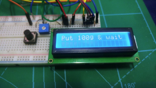 Put 100g on the build and wait for calibration